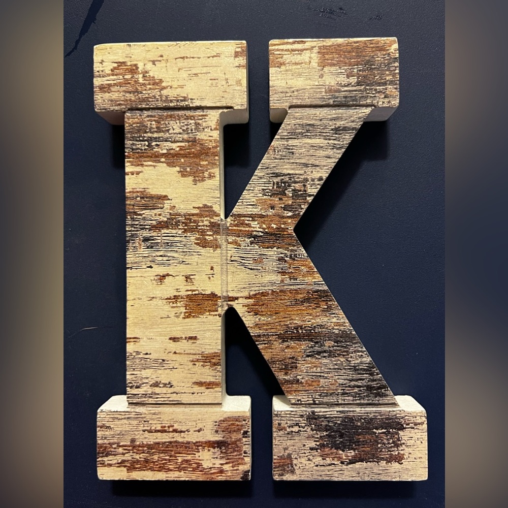 Set of two "K" wall decor...one metal, one wooden.